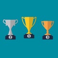 Gold, Silver and Bronze Trophy Cup on prize podium. First place award. Different champions or winners cups in flat style. Vector i Royalty Free Stock Photo